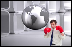 Businessman wearing red boxing gloves standing beneath a globe, symbolizing the challenges of prisoner reentry, overcoming a felony conviction, resilience, determination, and fighting to rebuild a successful life.